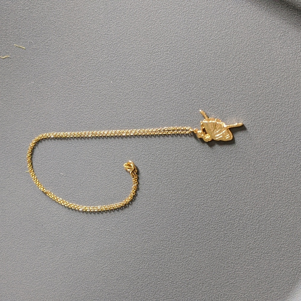 Gold ballerina necklace